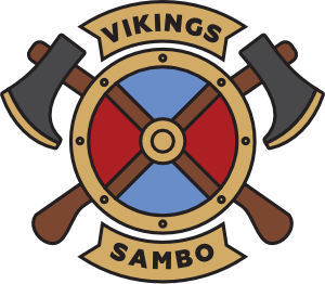 Logosymbol der Kampfschule für Selbstverteitigung ohne Waffen in Wiesbaden prägt ein Schild mit zwei Äxten. Die Inschrift Vikings ist oberhalb Schildrundung angeordnet. Das Wort Sambo befindet sind an der unteren Schildrundung.